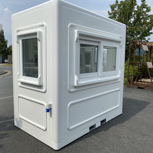 small white kiosk with a double sliding window